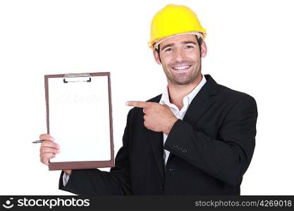 An architect pointing at his clipboard.