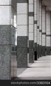 An architectural detail - a stone walk way in an office building