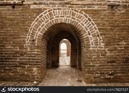 An architectural details view looking through the arches of one of the guard towers on the landmark Great Wall of China