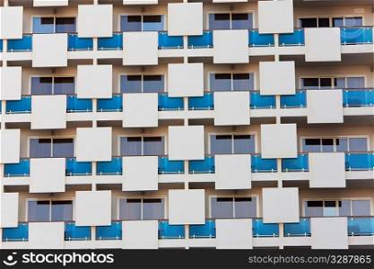 An architectural pattern in the external structure of a modern apartment building
