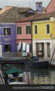 An array of houses on the side of a canal in Venice, Burano, Italy