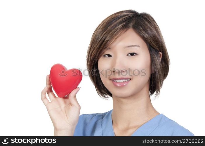 An Asian female cardiologist holding a red heart