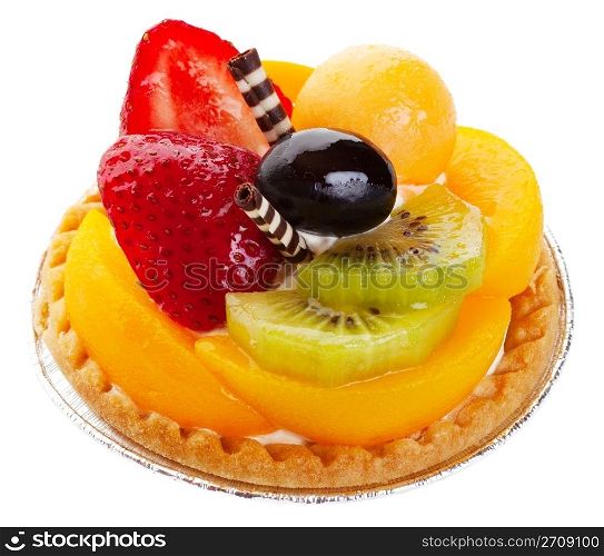 An Asian fruit tart stacked high with kiwi, peach, strawberries, melon balls, and a grape. Delicate rolls of striped white and dark chocolate garnish the center like mock chopsticks. Shot on white background.