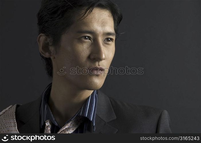 An asian male model in shirt and tie