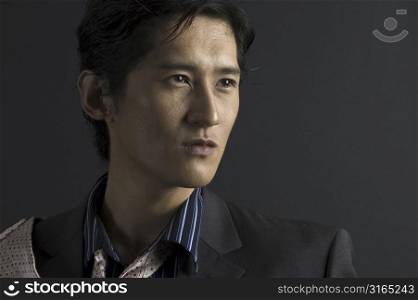 An asian male model in shirt and tie
