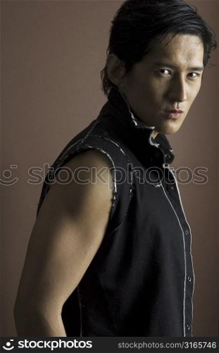 An asian male model looks serious