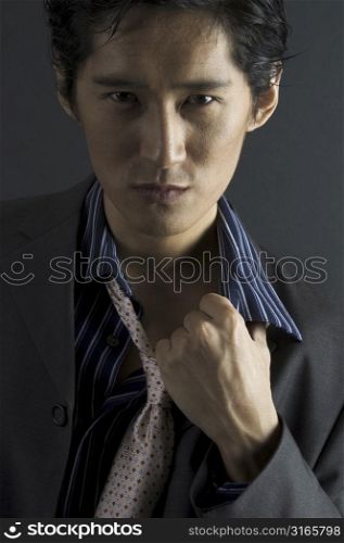 an asian model in smart casual clothing