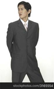 An asian model wearing a grey suit