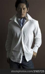 An asian model wears a cravat under a white shirt