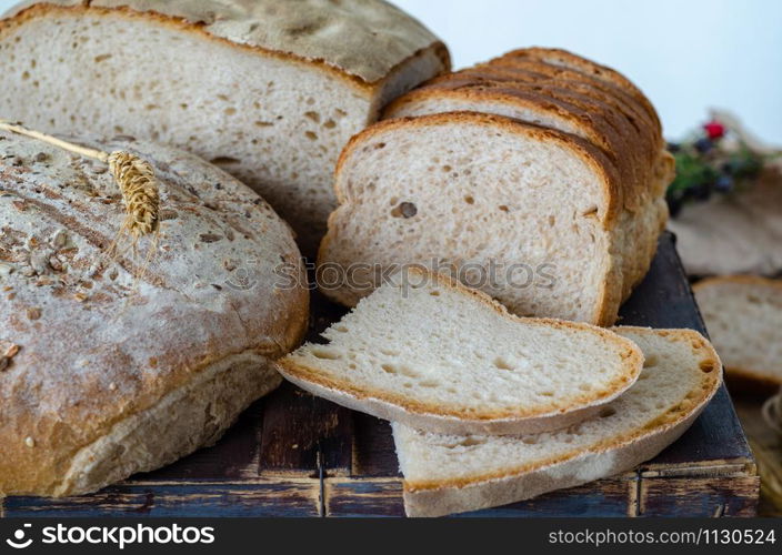 An assortment of bread , healthy whole grain breads with seeds