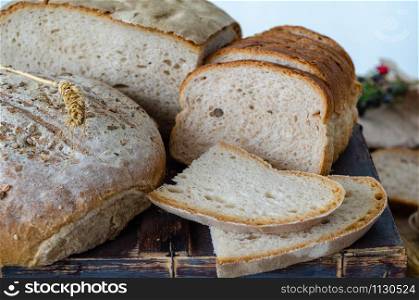 An assortment of bread , healthy whole grain breads with seeds