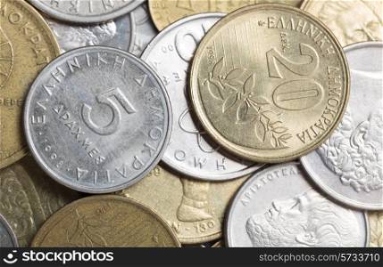 An assortment of Greek drachma coins from the 1990s