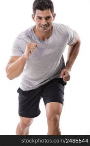 An athletic man running, isolated over a white background