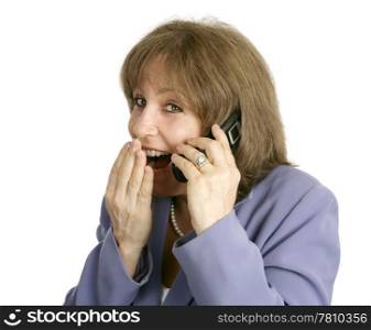 An attractive businesswoman hearing juicy gossip on her cellphone. Isolated.