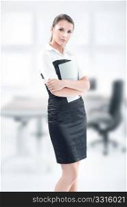 An attractive businesswoman holding files