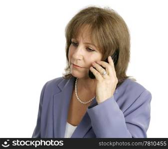 An attractive businesswoman listening to a cell phone conversation. Isolated on white.