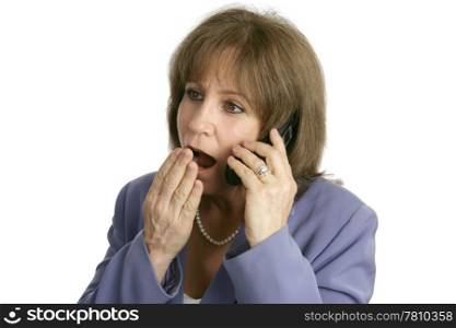 An attractive businesswoman shocked at office rumors she is hearing over the phone. Isolated.