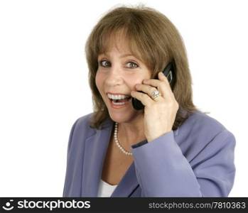 An attractive businesswoman very surprised and happy as she talks on her cellphone. Isolated.
