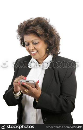 An attractive Indian businesswoman writing in her PDA. Isolated on white.