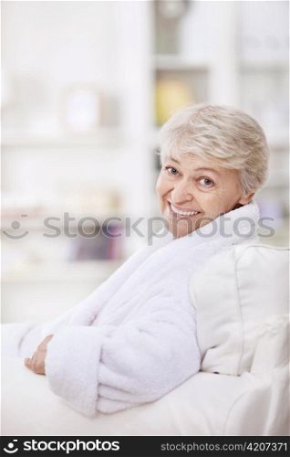 An attractive middle-aged woman in a white coat
