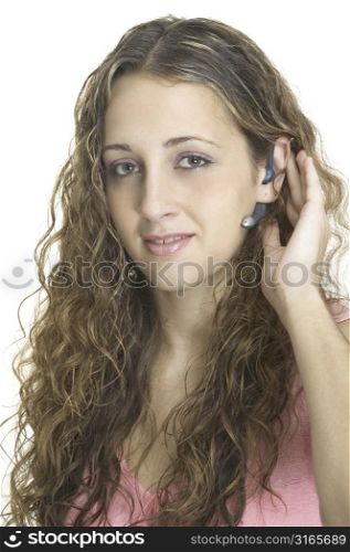An attractive model wearing a bluetooth headset