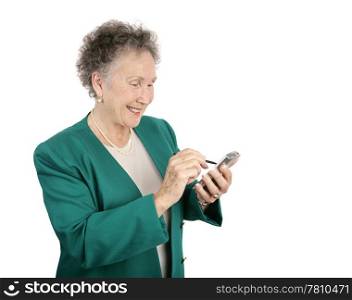 An attractive senior businesswoman having fun with her new PDA. Isolated on white with room for text.