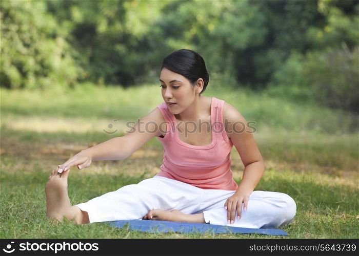 An attractive woman stretching