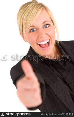 An attractive young blonde businesswoman gives a thumbs up to the camera, the focus is on her face.