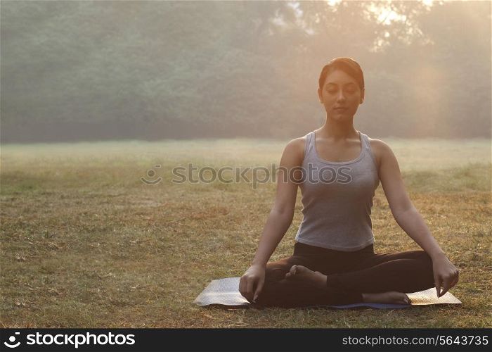 An attractive young woman doing yoga