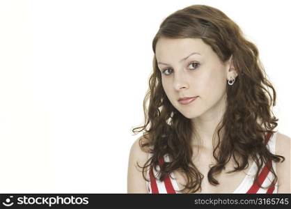 An attractive young woman in a red and white striped top looking at camera