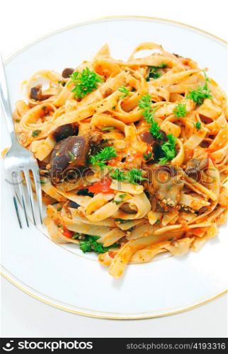 An aubergine (eggplant) and tomato sauce served tossed with fettuccelle pasta and garnished with fresh parsley