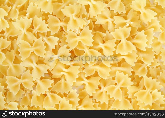 An background of uncooked pasta macro view