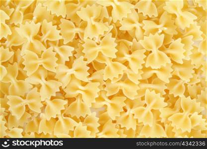 An background of uncooked pasta macro view