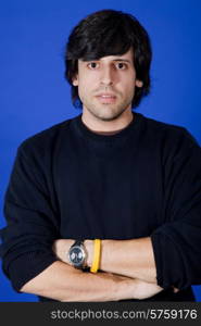 an casual young man portrait over a blue background