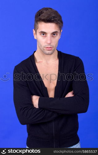 an casual young man portrait over a blue background