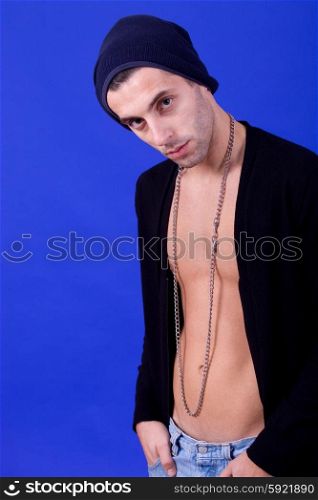 an casual young man portrait over a blue background