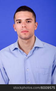 an casual young man portrait over a blue background