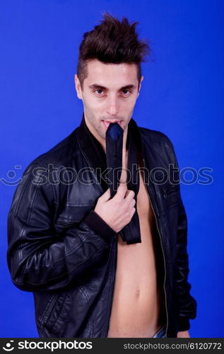 an casual young man portrait over a blue background