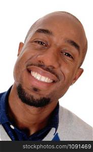 An close up portrait image of an African American man smiling bald and with a small beard, isolated for white background