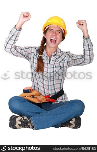 An ecstatic female construction worker.