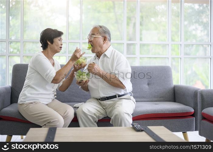 An elderly couple are eating healthy food , grandparents health care concept .. An elderly couple are eating healthy food , grandparents health care concept