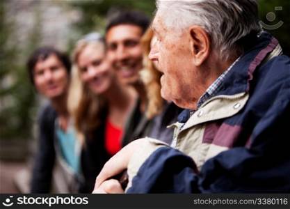 An elderly man telling stories
