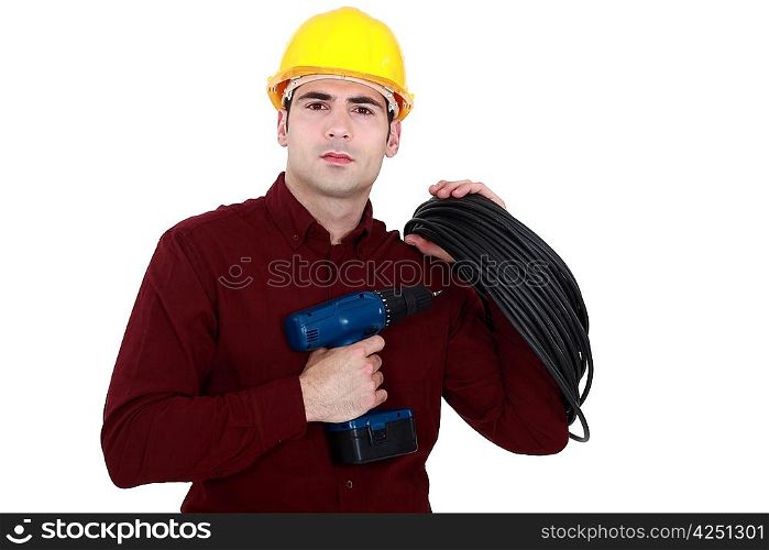 An electrician holding a drill.