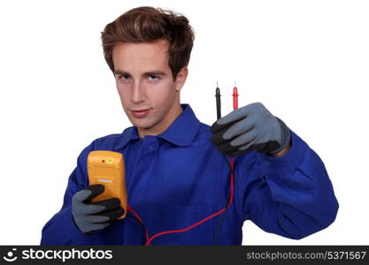 an electrician using an ammeter