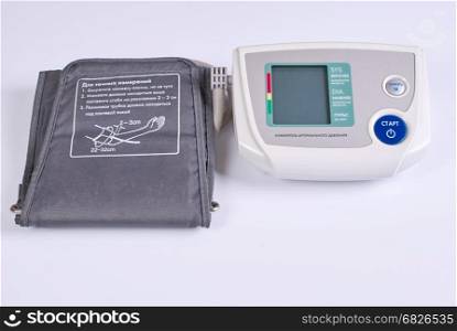 An electronic tonometer on a white background.. Automatic and manual sphygmomanometer on a white background.