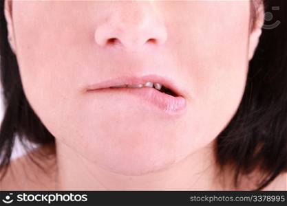 an embarrassed woman biting on her lip