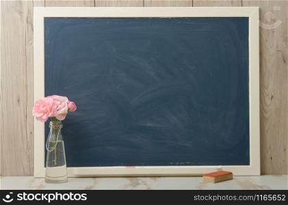 an empty blackboard with wooden frame