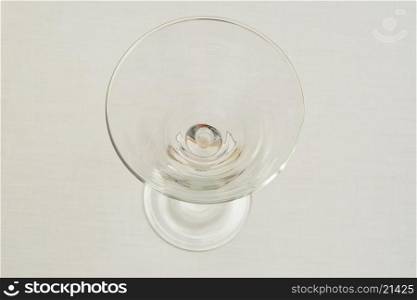 An empty martini glass isolated on a white background