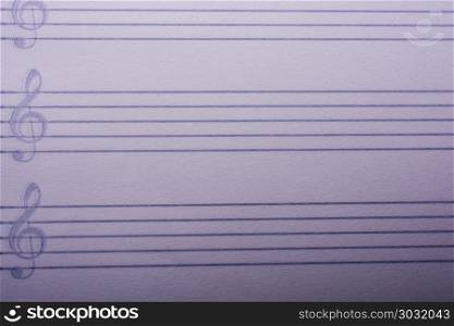 An empty note paper for musical notes. An empty white note paper for musical notes