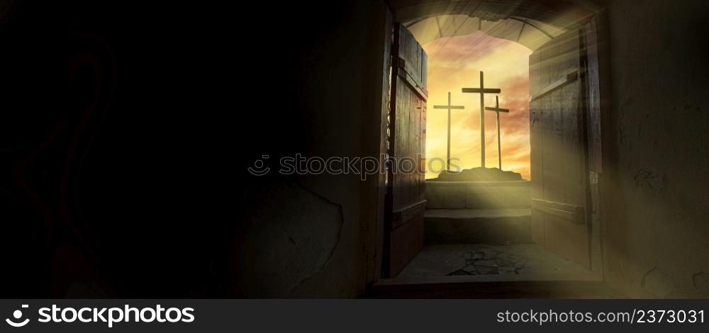 An empty tomb with three crosses